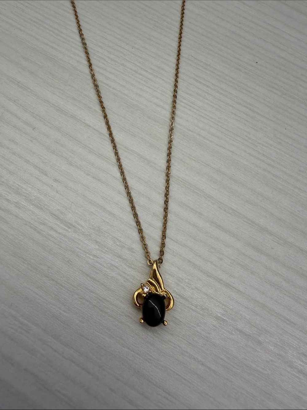 Gold-Tone Necklace with Black Stone Pendant